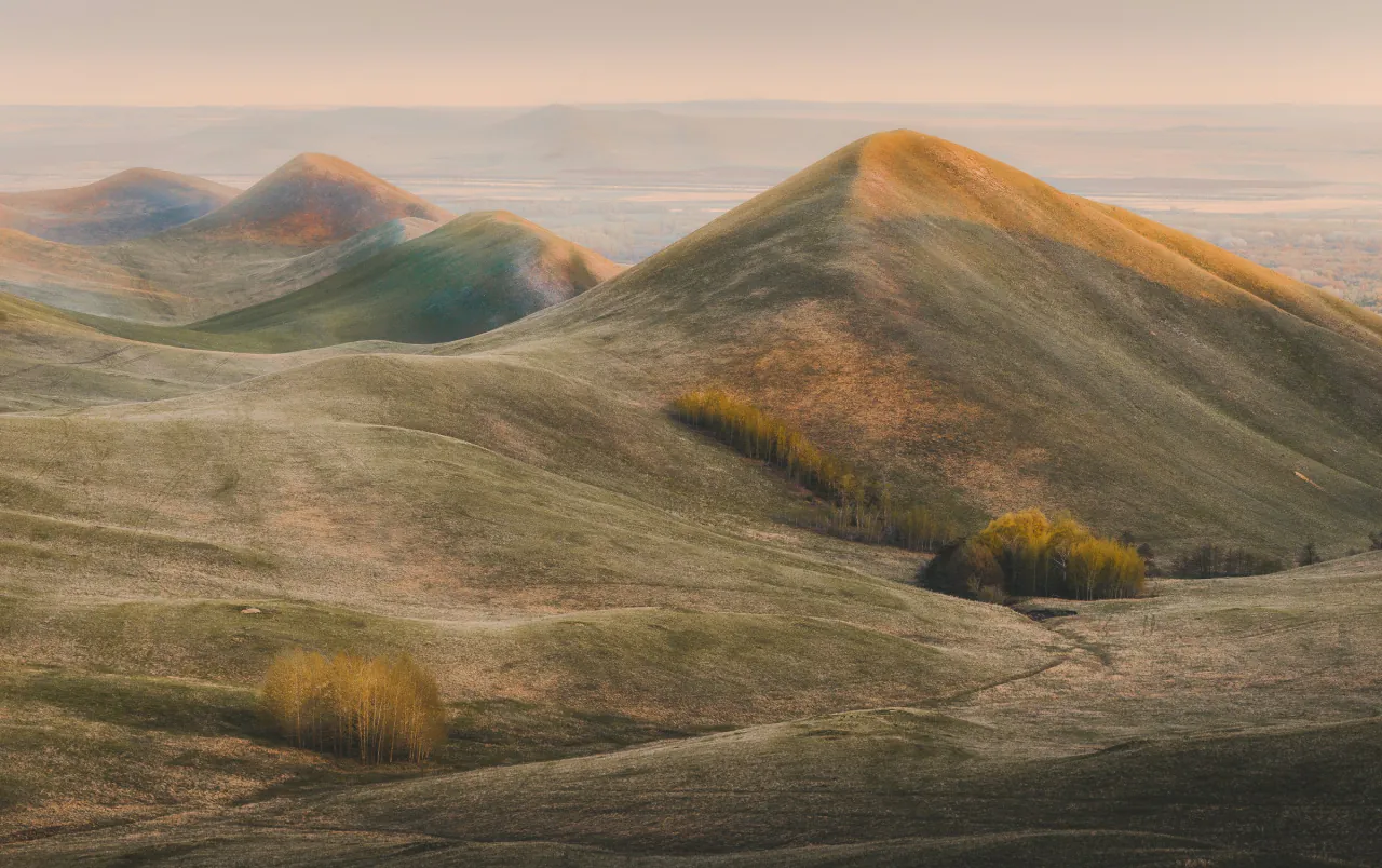 Grassy hills catching the last of the light